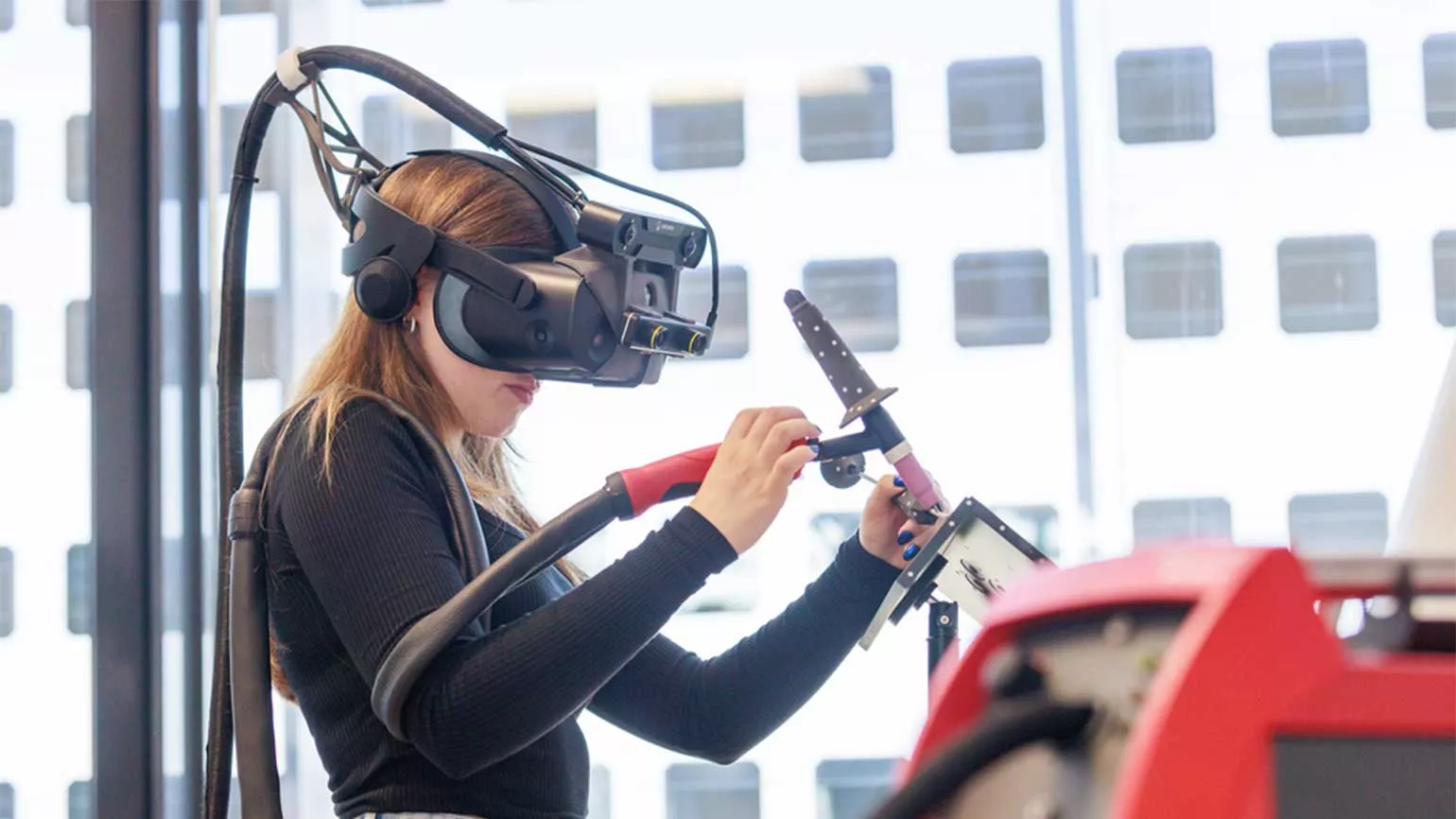 Girl welds with Welducation Simulator