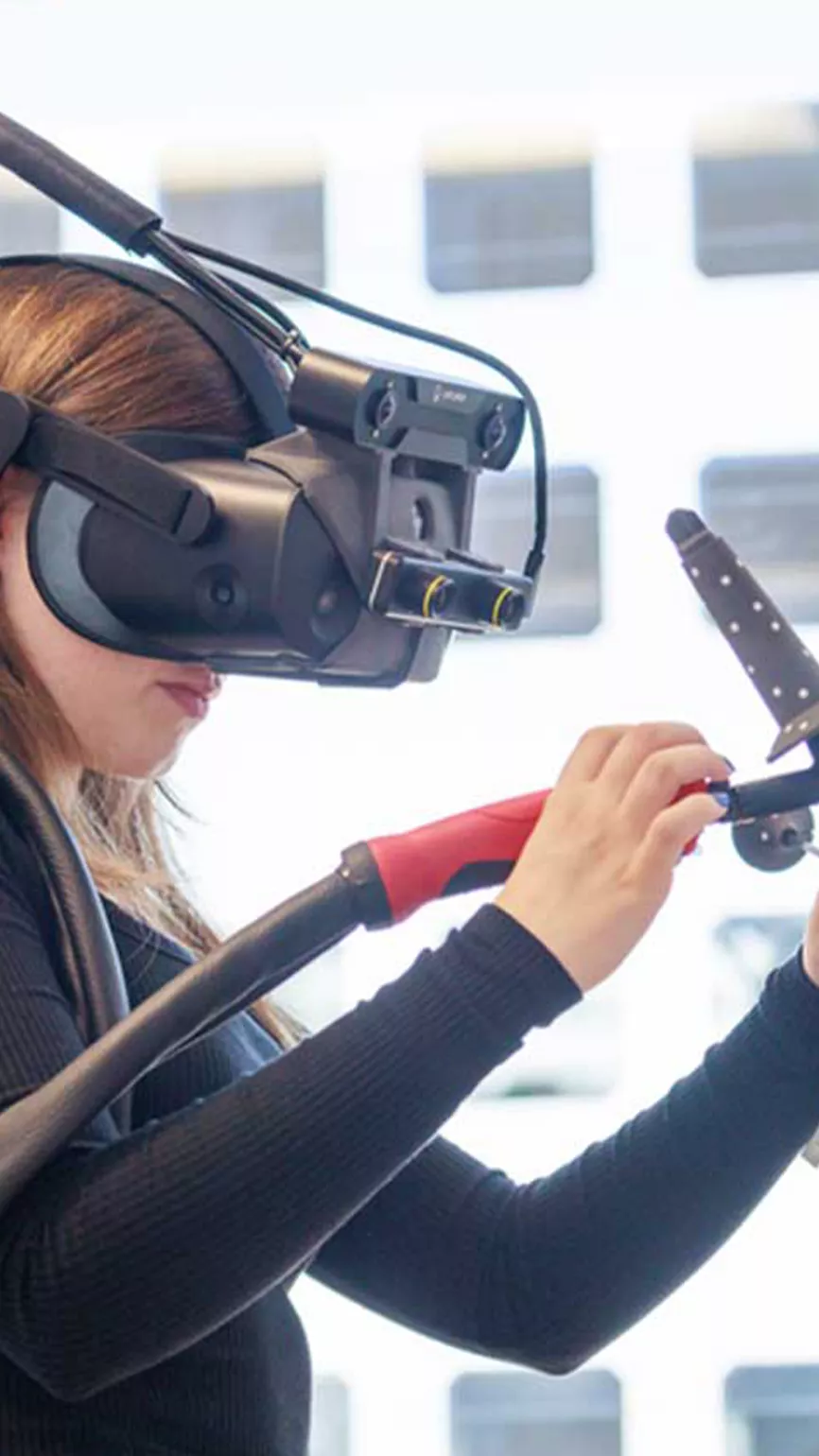 Girl welds with the Welducation Simulator