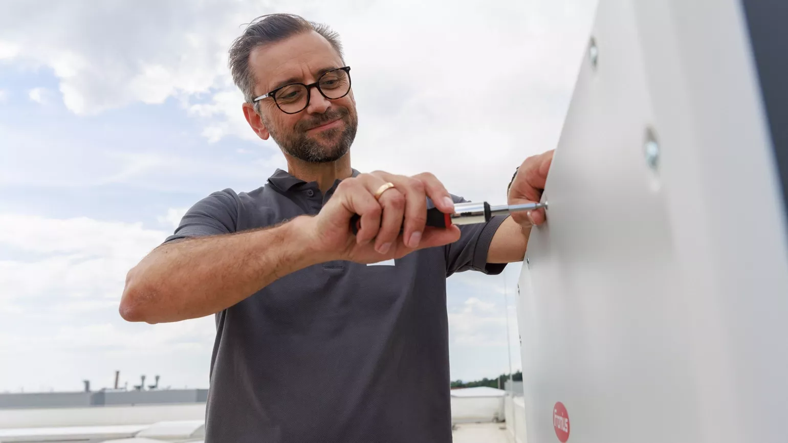 Installer mounting inverter
