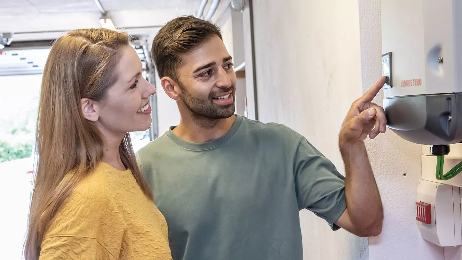 couple looks at inverter