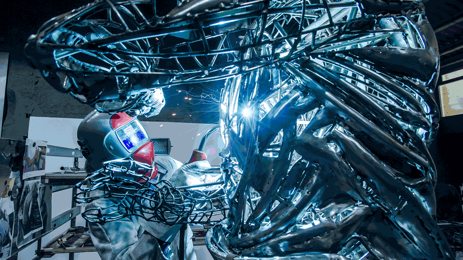 Person welds figure